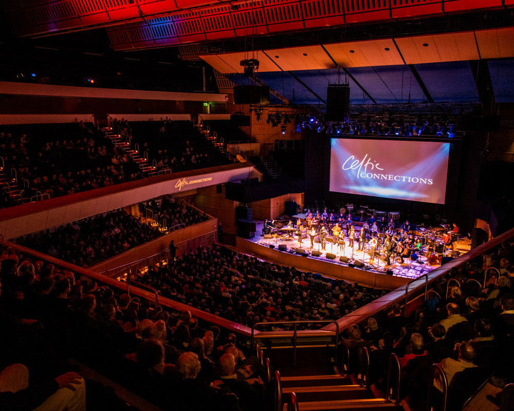 Glasgow Royal Concert Hall Main Auditorium with orchestra band on stage and a full audience. 