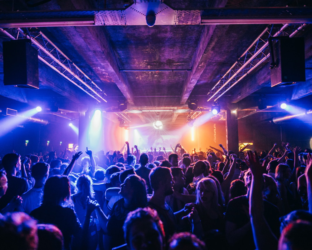 a view of the stage across a crowd at SWG3