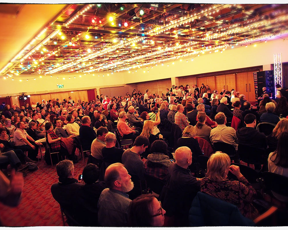 A seated audience at in Exhibition Hall
